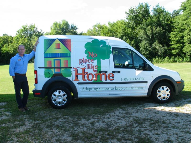 David Hubbard in front of No Place Like Home stairlift van